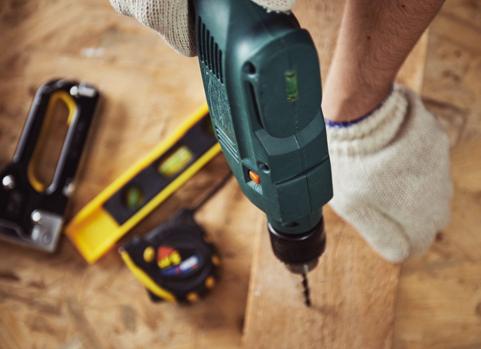 Carpenter working with wood and building tools